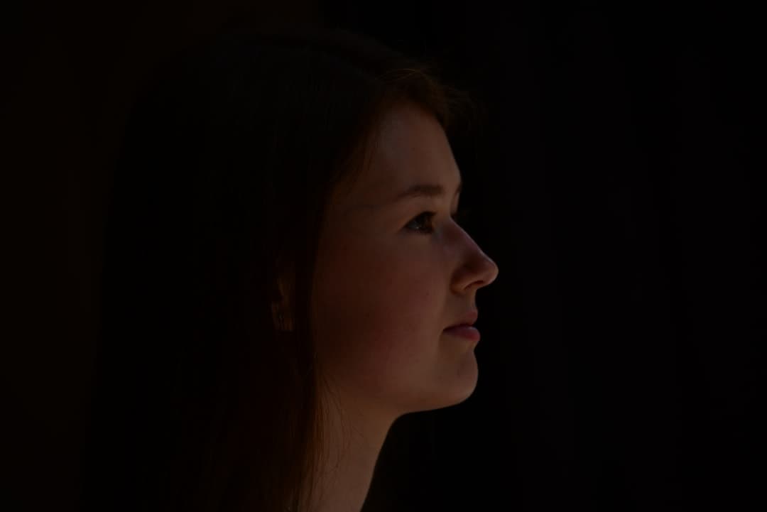 Illustrative image — a woman with long hair looking away from the camera