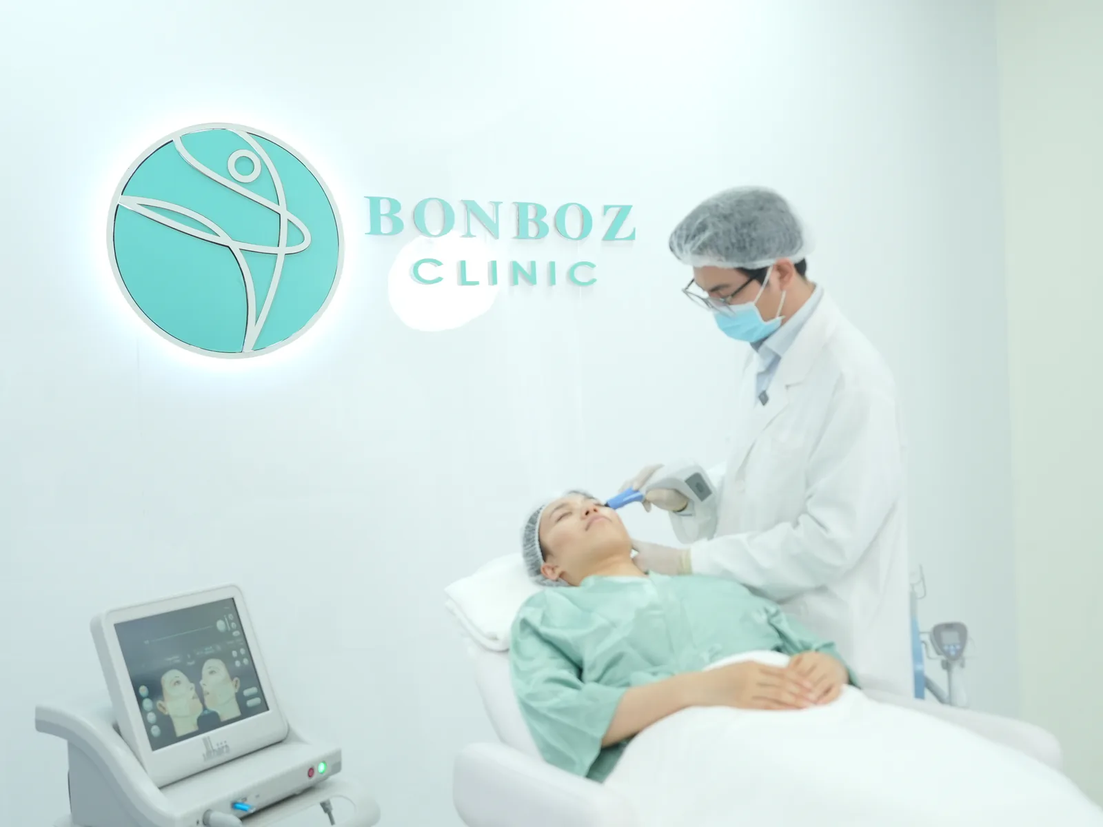 A doctor treating a patient in the procedure room